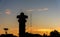 silhouette radar tower on Sunset sky