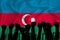 Silhouette of raised arms and clenched fists on the background of the flag of Azerbaijan. The concept of power,  conflict. With