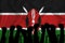 Silhouette of raised arms and clenched fists on the background of the flag of kenya. The concept of power,  conflict. With place