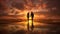 Silhouette and reflection of couple holding hands in sunset