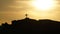 Silhouette of a religious Cross Crucifix against a sunset