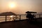 Silhouette of retro bicycle, family bike, fence, ocean, mountain