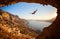 Silhouette of a rock climber falling of a cliff