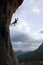 Silhouette of rock climber going down