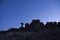 Silhouette of a rocky hilltop including balanced rock