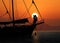 Silhouette romantic couple in love on sailboat