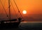 Silhouette romantic couple in love on sailboat