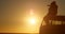 Silhouette of romantic couple sitting on roof of van 4k