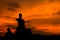 Silhouette ruined Buddha statue, Thailand