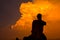 Silhouette ruined Buddha statue, Thailand