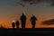 Silhouette of runners with orange sky