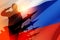 Silhouette of russian soldier and missiles in uniforms on background of the Russian flag. 3d rendering.