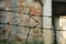 Silhouette of rusty barbed wire on blurred background