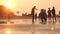 Silhouette of Sae Beach Sunset Time . A group of people enjoying winter or summer vacation at Saint Martin Island