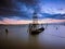 Silhouette sailboat on sea against sky during dunset