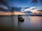 Silhouette sailboat on sea against sky during sunset