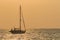 Silhouette of sailing yacht boat floating over sun set sky sea ,