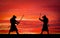 Silhouette of samurais in duel. Picture with two samurais