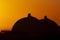 Silhouette of San Onofre nuclear power plant main reactors at sunset