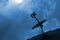 Silhouette of a satellite dish aimed at the night sky