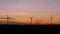 Silhouette scenic of wind turbine for electric generation eco and clean power in the sunset atmosphere