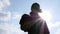 Silhouette of Senior Asian farmer took off a hat and wiped off the sweat on his face after work on sky background