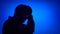 Silhouette of senior frustrated man. Sad male`s face in profile in despair on blue background