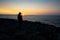 Silhouette Serenity: A Young Soul Embraces Rethymno\\\'s Sunset Magic