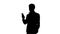 Silhouette Serious businessman looking at his phone.