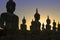 The silhouette shot of Buddha statues
