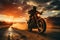 A silhouette shot of a motorcycle rider riding towards a captivating sunset.