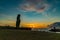 Silhouette of single Moai at Fisherman Port in The Village of Hanga Roa