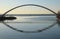 Silhouette of a single mounted cyclist on Humber Bay Arch Bridge