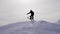 Silhouette of skier jumping on mountain ski slope.
