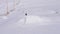 Silhouette of skier jumping on mountain ski slope.