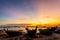 Silhouette Small fishing boat at shore in sunset at Bang Phra Beach,sriracha choburi,thailand