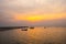 Silhouette small fishing boat in sunset at Bang Phra Beach,sriracha chon buri,thailand