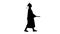 Silhouette Smiling female student in graduation robe walking wit