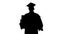 Silhouette Smiling graduate male in mortarboard holding blank sign.