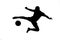 A silhouette of a soccer player shooting a ball