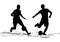 Silhouette soccer players hitting the ball.Vector