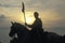 Silhouette of soldier on horseback with gun during reenactment of Battle of Manassas marking the beginning of the Civil War