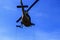 Silhouette Soldier Jump rope from helicopter in blue sky