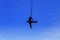 Silhouette Soldier rescue emergency by army helicopter with rope on blue sky