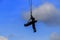 Silhouette Soldier rescue emergency by army helicopter with rope on blue sky