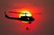 Silhouette Soldiers rappel down to attack from helicopter with warrior beware danger On the ground sunset Background blur