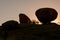 Silhouette of solid granite boulders at sunrise at Ameib