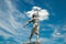Silhouette of Soviet woman statue with blue sky and white cloud on background