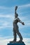 Silhouette of Soviet worker statue with sky background. Social realism monument in Odessa countryside of Ukraine.