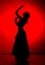 Silhouette of spanish girl flamenco dancer on a red background